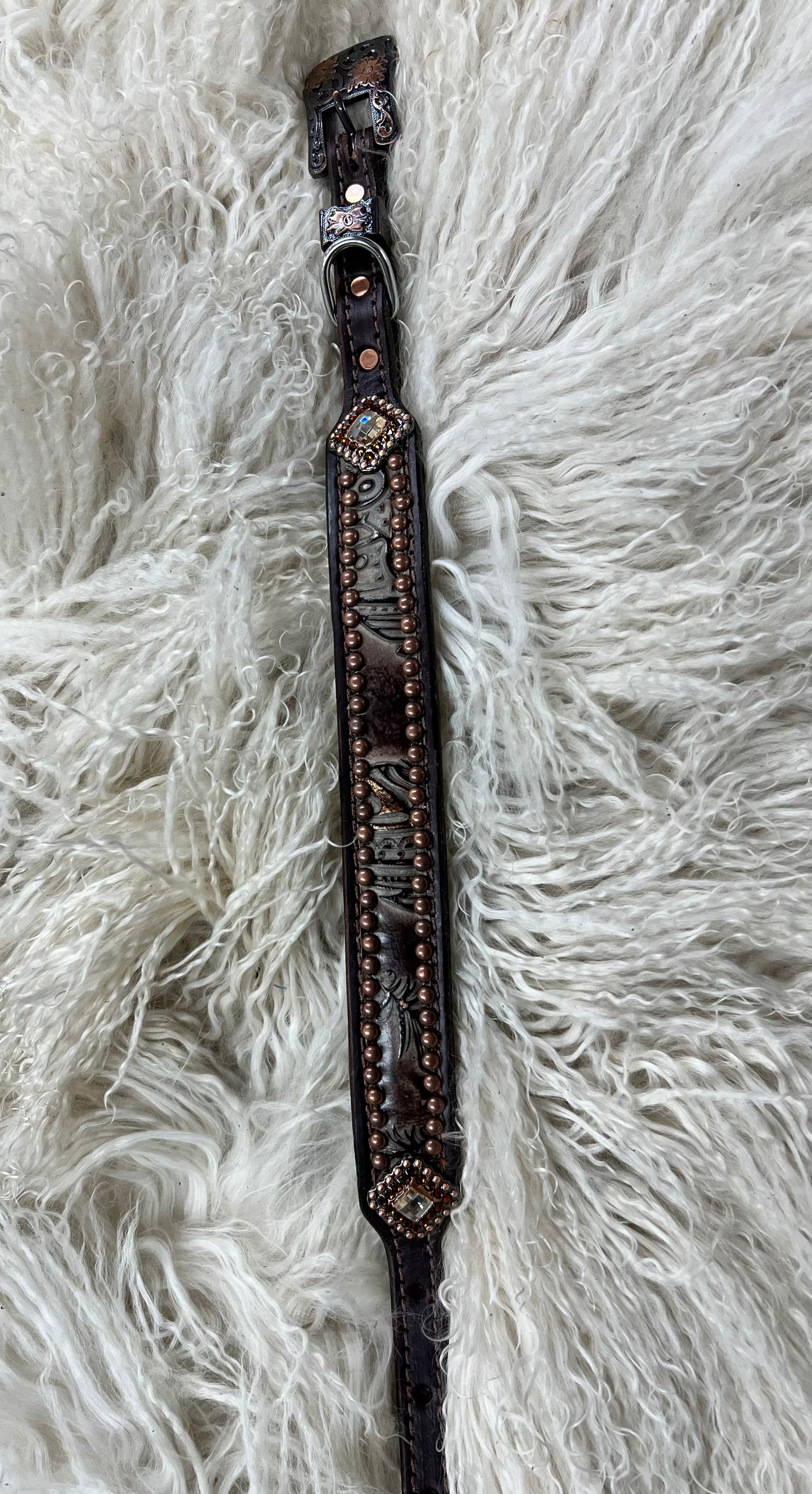 chocolate feathers on dark leather