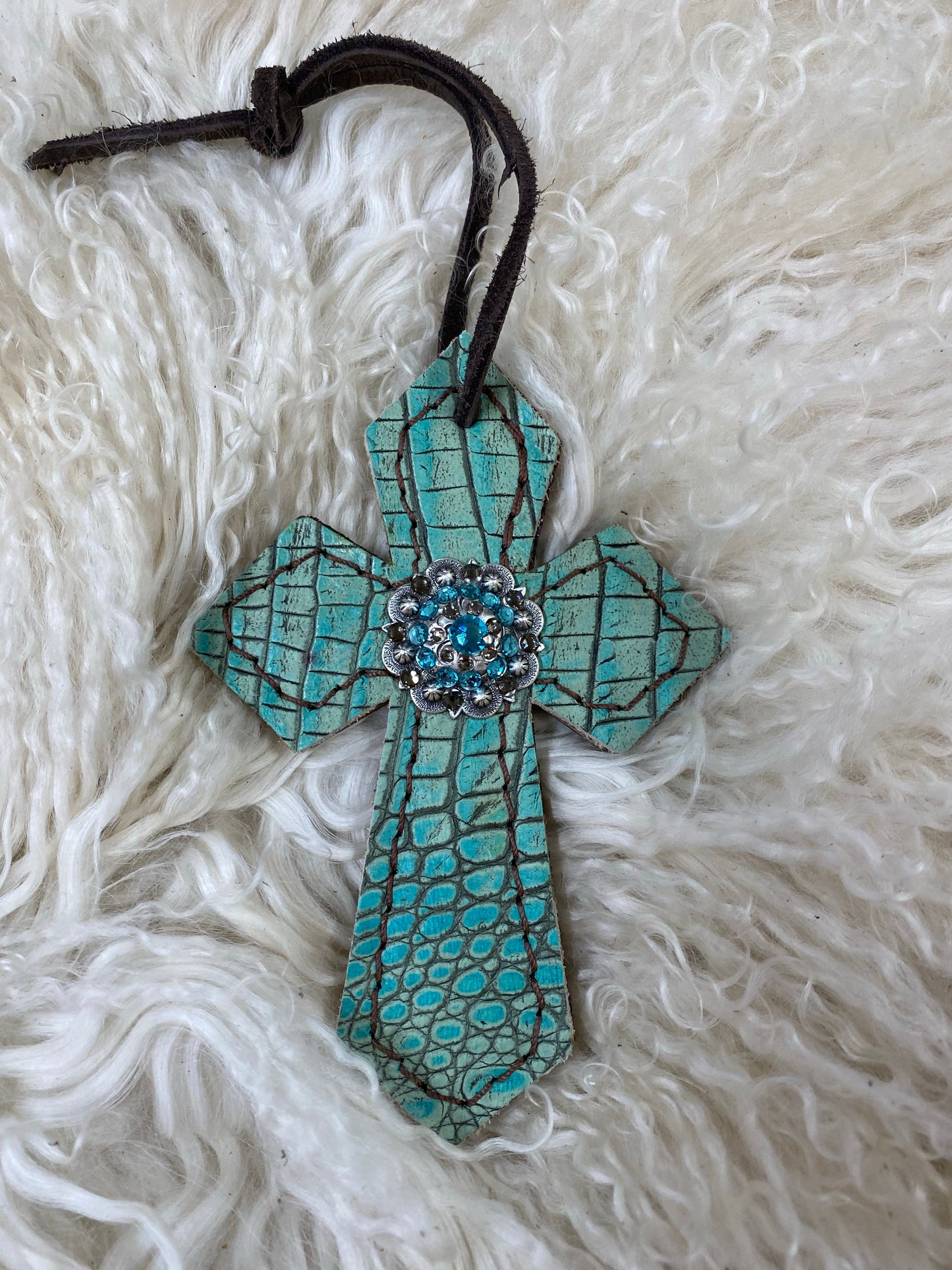 Antique turquoise gator on dark leather